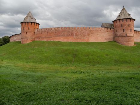 Panorama view of walls and Fyodorovskaya and Mitropolichya towers of Novgorod Kremlin. Summer cloudy day in Veliky Novgorod, Russia.