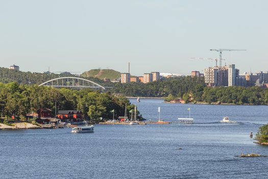 View from ship to suburbs of Stockholm. Ferry trip across Baltic Sea. Tourism to Europe and Scandinavia. Sweden.