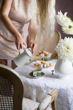 tea break in english style, vintage retro still life, homemade buns and a bouquet of white dalias. High quality photo