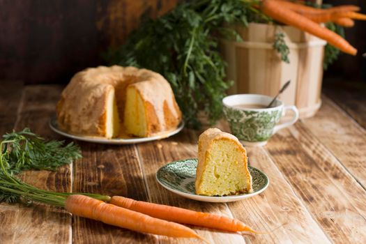 Sugar glazed carrot cake, homemade baked goods, rustic still life, national carrot cake day, cup of coffee. High quality photo