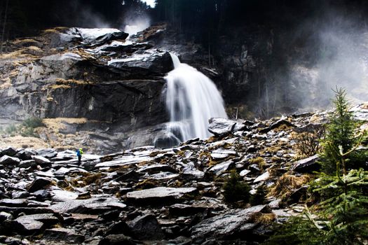 Beautiful landscape showing Krimmler waterfall in a rocky mountain in Austria in a long exposure picture