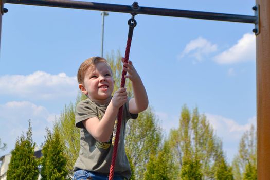 Modern children playground in park. Made in different colors. High quality photo.