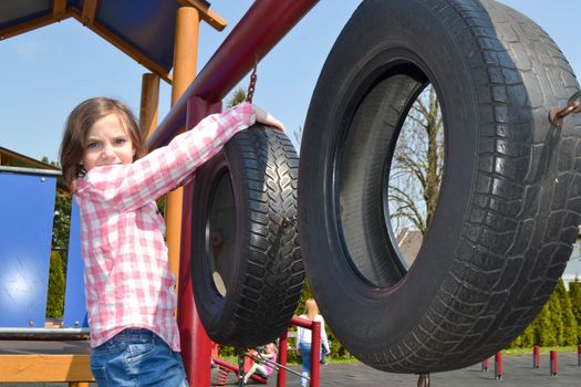 Modern children playground in park. Made in different colors. High quality photo.