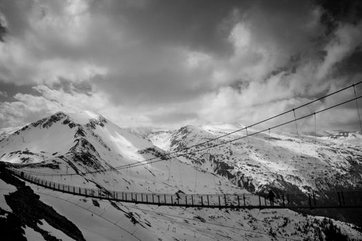 Snowy mountains and a rope bridge in a ski station in Bad Gastein in Austria