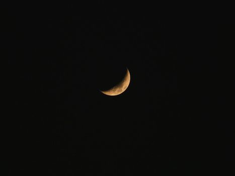 Natural night background with dark sky and half Moon, Earth satellite. Waxing Crescent phase.