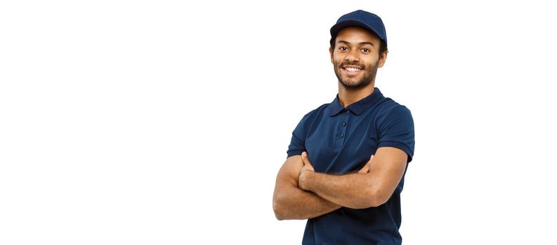 Delivery Concept - Handsome African American delivery man crossed arms over isolated on white studio Background. Copy Space.