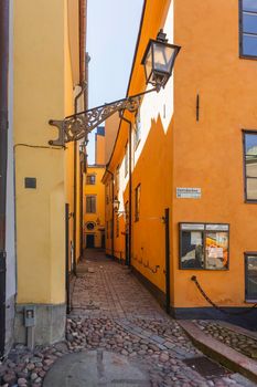 STOCKHOLM, SWEDEN - July 06, 2017. Narrow streets in historic part of town. Old fashioned buildings in Gamla stan.