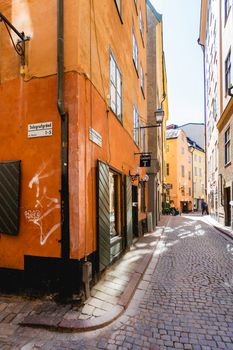 STOCKHOLM, SWEDEN - July 06, 2017. Narrow streets in historic part of town. Old fashioned buildings in Gamla stan.