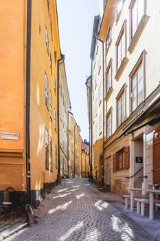 STOCKHOLM, SWEDEN - July 06, 2017. Narrow streets in historic part of town. Old fashioned buildings in Gamla stan.