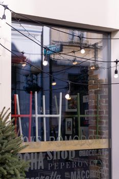 Italian cafe showcase with overturned chairs and light bulbs