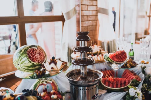 Table with food for the holiday. Cuisine. Culinary Buffet. Dinner Catering. Dining Food. Celebration Party. Concept wedding birthday. Sweet pastries desserts