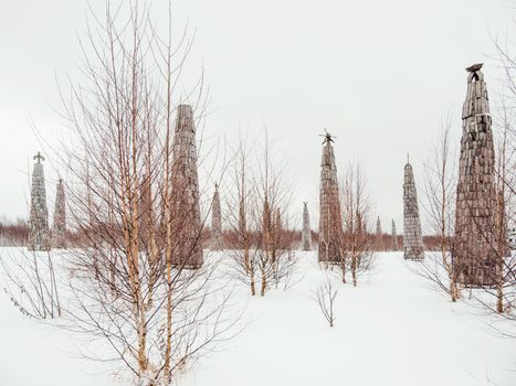 NIKOLA-LENIVETS, RUSSIA - January 15, 2017. Wooden art object, exhibit of architectural festival Archstoyanie. Winter cloudy day.