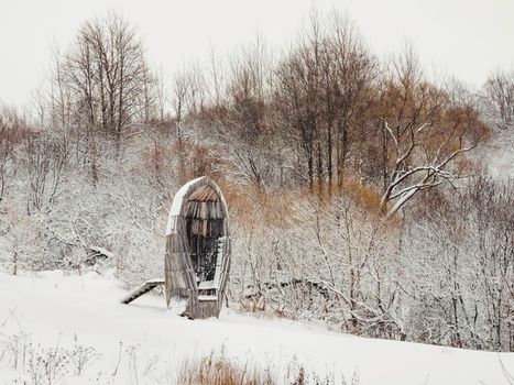 NIKOLA-LENIVETS, RUSSIA - January 15, 2017. Artobject Nikolin Ear by Vladislav Savinkin, Vladimir Kuzmin. Wooden object in winter forest.