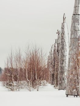 NIKOLA-LENIVETS, RUSSIA - January 15, 2017. Wooden art object, exhibit of architectural festival Archstoyanie. Winter cloudy day.