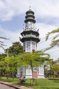 BANGKOK, THAILAND - October 23, 2012. Clock tower in Lumpini park. Ornamental building with architectural decorations in urban recreational park.