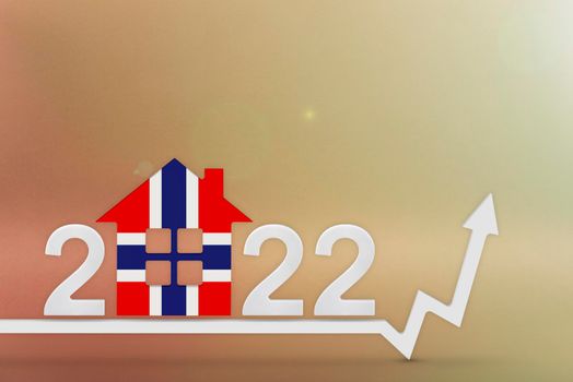 The cost of real estate in Norway in 2022. Rising cost of construction, insurance, rent in Norway. House model painted in flag colors, up arrow on yellow background.