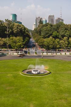 HO CHI MINH, VIETNAM - March 28, 2009. Fountain and neatly trimmed lawn in front of Independence Palace or Reunification Convention Hall.