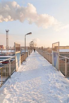 MOSCOW, RUSSIA - January 01, 2010. Man is going on bridge over Studencheskaya subway station of Moscow underground before renovation.