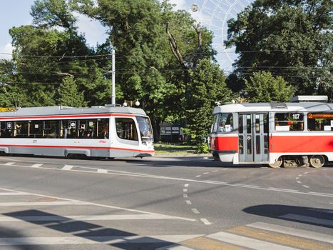 KRASNODAR, RUSSIA - June 02, 2021. Old and modern trams meet each other on urban road of Krasnodar.