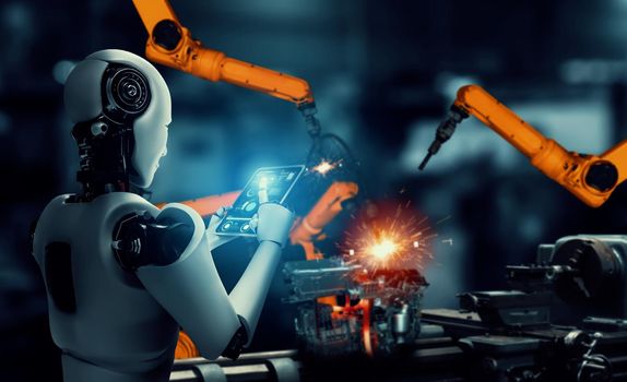 Mechanized industry robot and robotic arms for assembly in factory production . Concept of artificial intelligence for industrial revolution and automation manufacturing process .