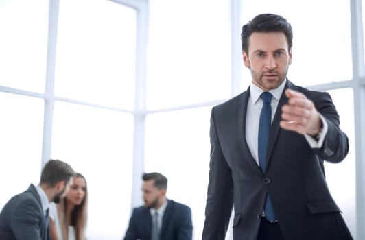 serious businessman pointing at you.business concept