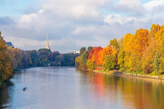 Turin, Piedmont Region, Italy - Circa November 2021: landscape in autumn with Po' river and blue sky.