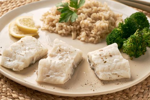 healthy meal full of vitamins and minerals, cod and rice with broccoli