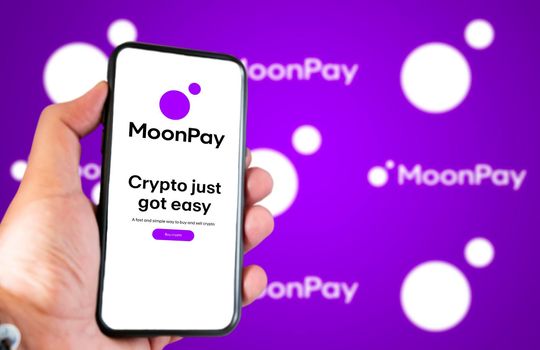 London, UK, March 2022: MoonPay company website on a phone screen. Purple background with MoonPay logo blurred in the background. Illustrative editorial. Selective focus.
