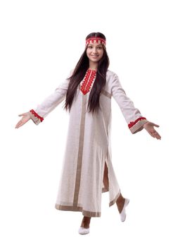 Young girl in dance pose - flax traditional russian costume