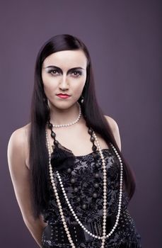 relaxed woman with long hair and pearl beads - retro style