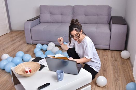 Working from home. beautiful young woman working using laptop while sitting in home office