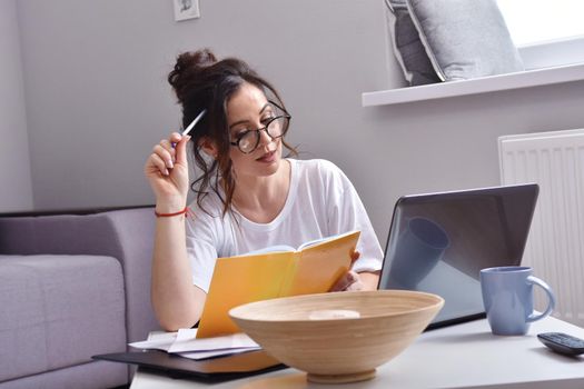 Working from home. beautiful young woman working using laptop while sitting in home office