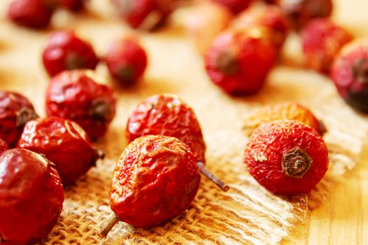 Rosehip seed essential oil in a small bottle. Selective focus.Na