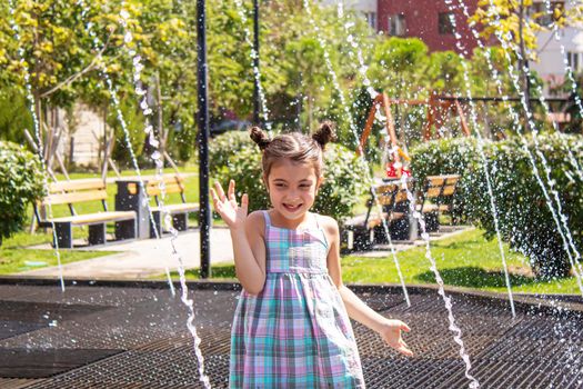 happy child playing in the fountain selective focus.people