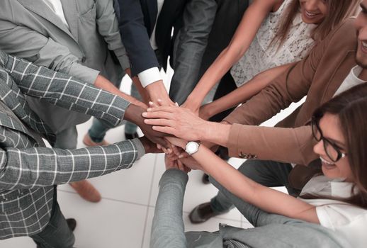 close up.Business people holding hands in a circle.the concept of unity