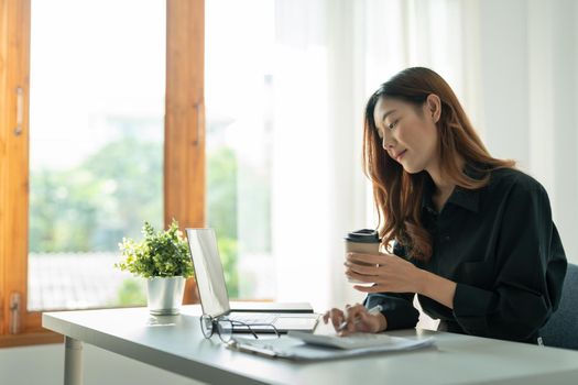 Asian small business owner working at home office. Business retail market and online sell marketing delivery, SME e-commerce concept
