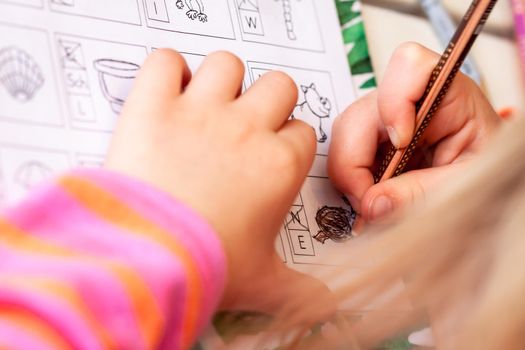 ESSEN, GERMANY - MAY 05 2020 : Little girl doing her homework during the pandemic.