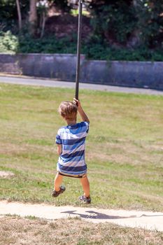 Happy kid on zip line in the city of Essen - Germany.