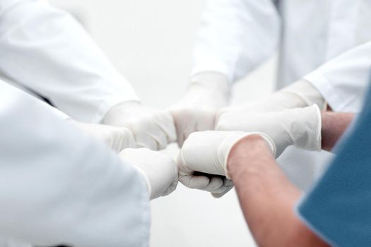 Doctors and nurses coordinate hands. Concept Teamwork in hospital