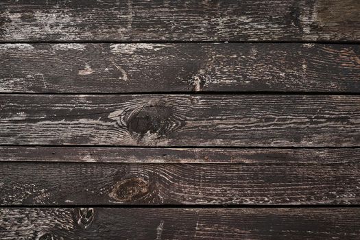 Rustic old dark wooden background with a pine wood, structure of wood with knots