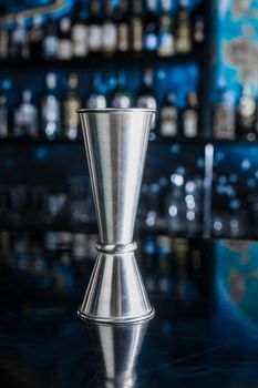 Jigger is a metal bar instrument or measuring cup for controlling and the amount of ingredients added to the cocktail.