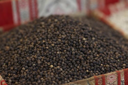 Close-up of bunch of black pepper, tiny round food ingredient, spice, seasoning, taste. Peppercorn, cooking ingredients, flavor, pepper grains concept