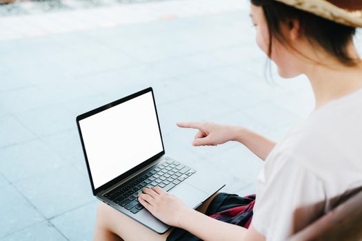 summer, relax, vacation, travel, portrait of beautiful Asian girl using the computer laptop at the train station while waiting for their travel time