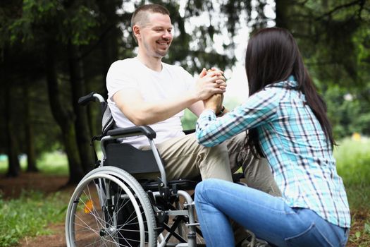 Portrait of wife and husband have meeting in nursing home, support in recovery. Disabled people problem, healthcare, family, support, help, nature concept