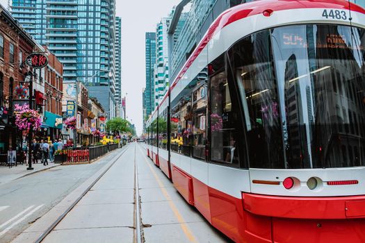 TTC Close view os a streetcar in downtown Toronto's entertainment district. New tram on streets of Toronto