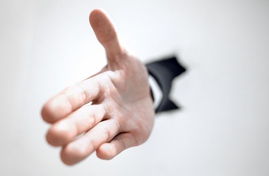 close up. businessman holding out his hand for a handshake.photo with copy space