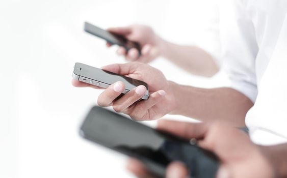 close up. smartphones in the hands of the business team.people and technology