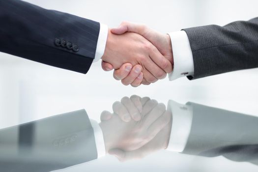 Business handshake. Close-up of business men shaking hands.