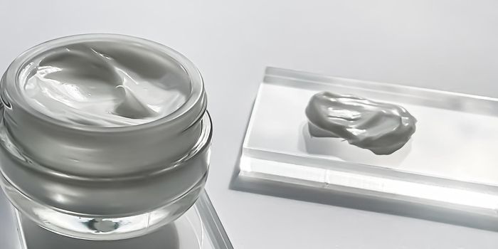 Face cream moisturiser jar and product sample on glass, beauty and skincare, cosmetic science concept