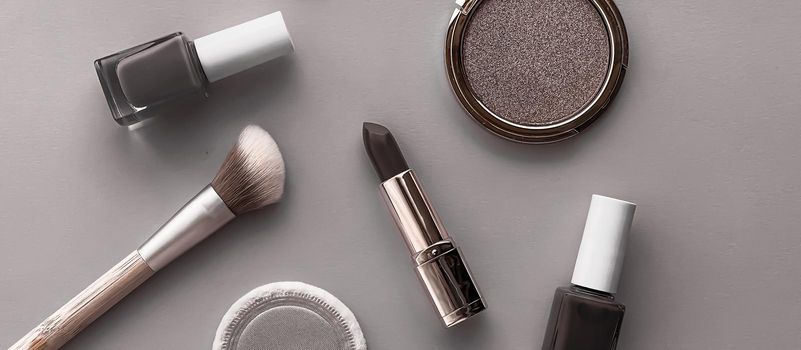Beauty, make-up and cosmetics flatlay design with copyspace, cosmetic products and makeup tools on gray background, girly and feminine style concept
